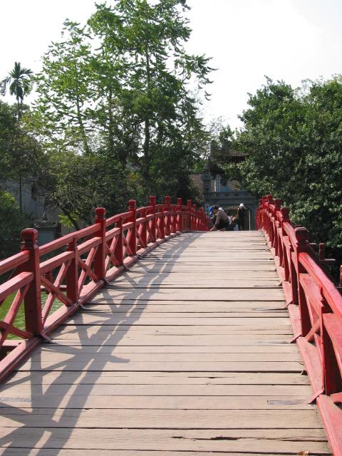 Crossing bridge at Ngoc Son temple