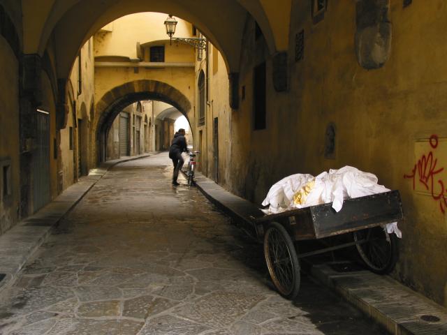 small street with cart and man with bicycle, Firenze