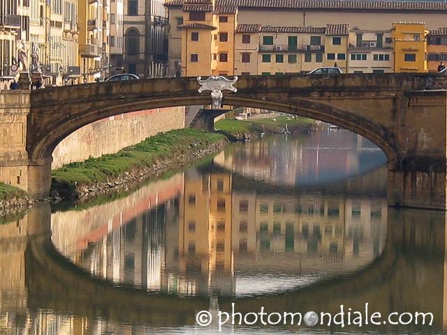 Bridge over the Arno with buildings reflected under its arch, Firenze