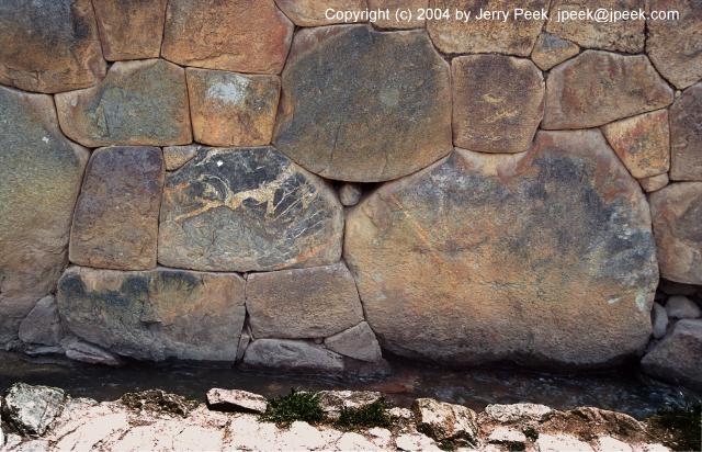 Bottom of stone wall and water channel, Ollantaytambo, Peru