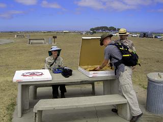California State Park Rangers with pizza for beach cleanup volunteers