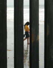 Mexican Scout through the border fence