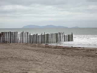 Border fence extending into Pacific Ocean at Imperial Beach, California