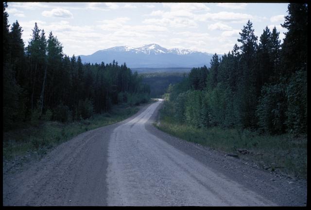 Dempster Highway stretches north toward distant mountain