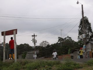 Waiting at the crossroads for a ride - south of Tonchigüe, Ecuador