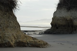 View of the cliffs above Same and Tonchigüe, from between the stacks near Playa Escondida, Ecuador